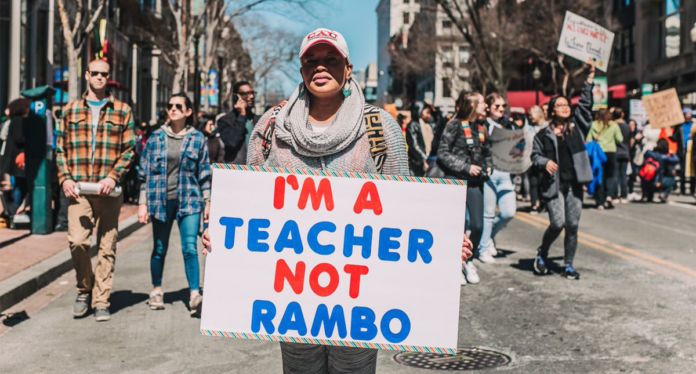 March for our Lives sign, teacher