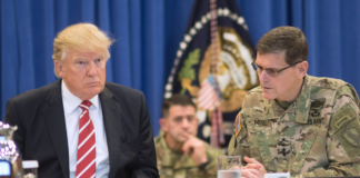 President Donald Trump discusses current military operations with Gen. Joseph Votel, commander of U.S. Central Command Commander, at MacDill, AFB, FL, Feb. 6, 2017. (DoD photo by D. Myles Cullen/Released)